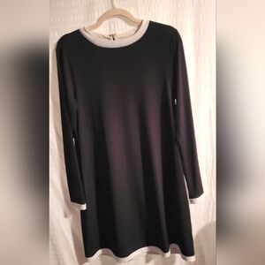 Michael Kors black dress with white trim at neck, hem and sleeves.  Size Medium
